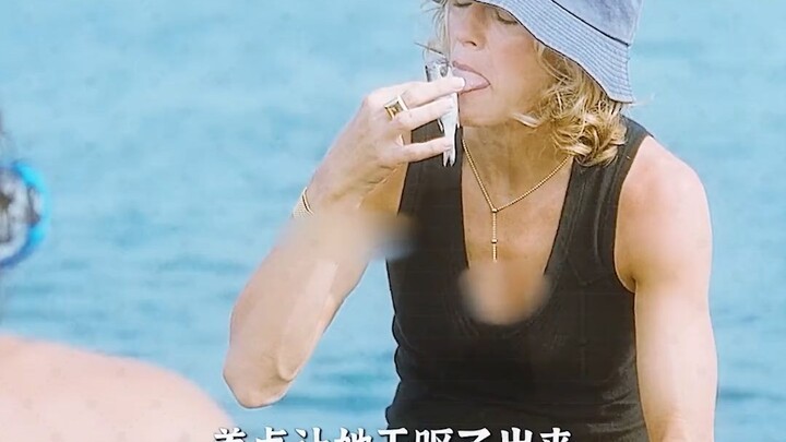 A man takes a big gulp of seawater and discovers something underwater.