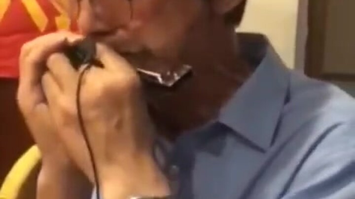 One harmonica conjures up an entire band.