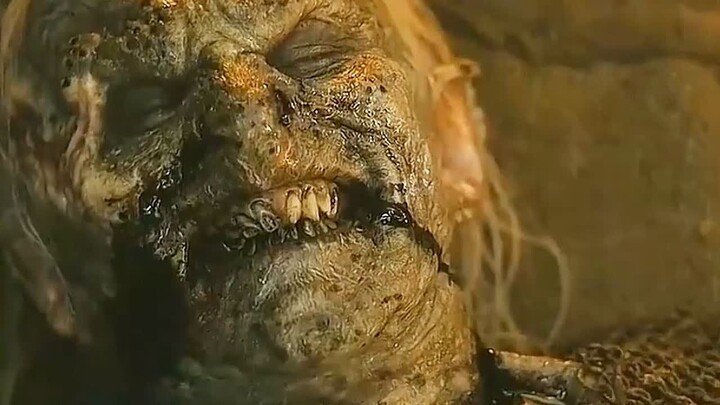 A grievously wounded orc, witnessed by all his comrades, is granted the highest honor of the orcs.