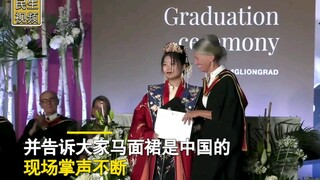 International students attended the graduation ceremony in a nearly 600-person auditorium, dressed i