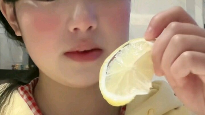 Challenging myself to eat a lemon with a blank expression