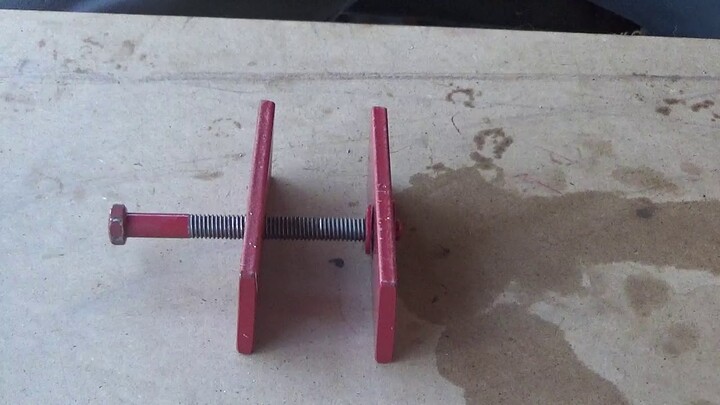 Brake Caliper Compressor out of scrap metal and a bolt