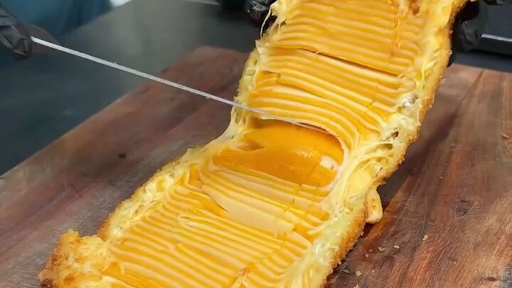 A big piece of grilled ribs + garlic bread soaked in oil + a huge piece of fried cheese...it's a cal
