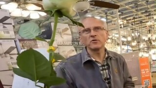 The young man randomly gives flowers to a gentleman—let's see how the other person reacts!
