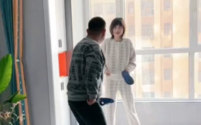 A marital battle unfolds, while the child giggles happily nearby