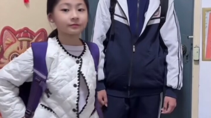 Each generation has its own way of raising kids. The older brother just picks up his little sister o