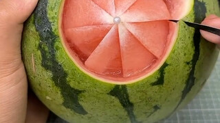 This guy's a real pro—turning watermelons into something I can't afford!