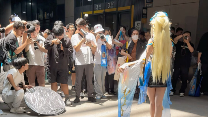 Why are there so many people surrounding Katishia?