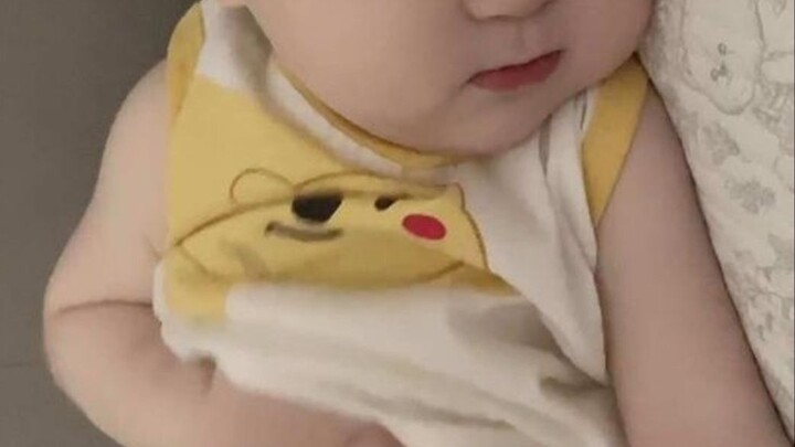 The baby’s fair, tender skin—so cute! He’s asleep, scratching his tummy. I can’t even imagine how ad