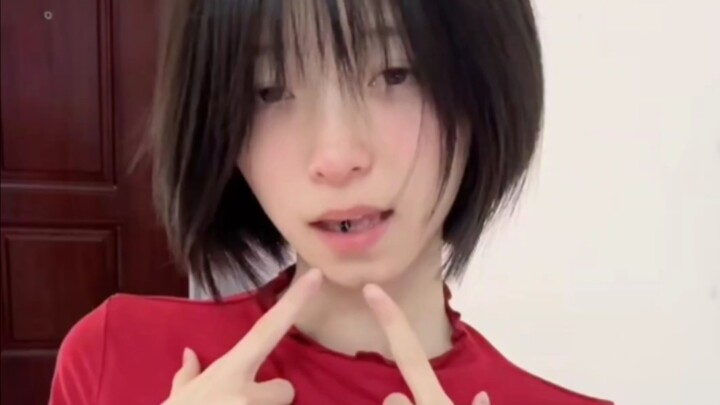 The sister with short hair and a tongue piercing