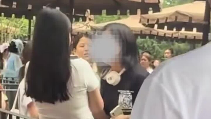 A girl at Universal Studios broke down in tears after being wrongly accused of secretly taking photo