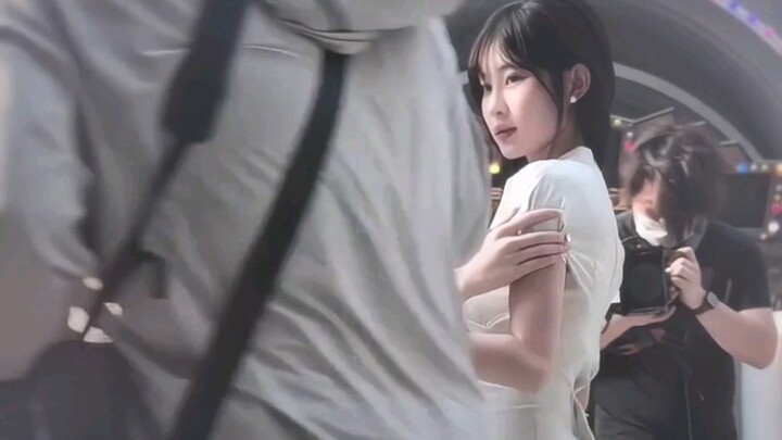 Senior female student puts on a cheongsam