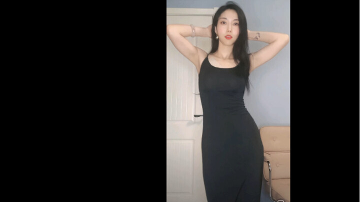 Skinny young woman dancing in black dress — Live streaming video of a certain audio platform