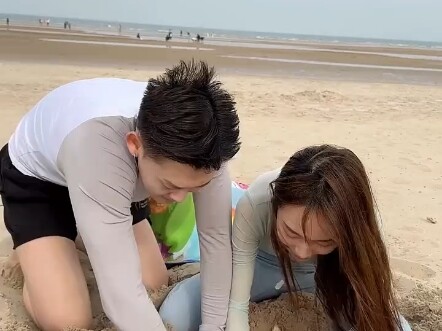 Bury a Bluetooth speaker on the beach, pretend there's someone there, and ask your girlfriend to res
