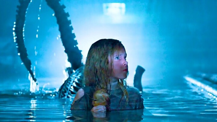 In the water, the little girl has been parasitized by face-hugging bugs