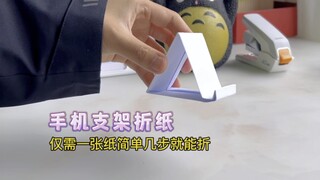 Butuh dudukan ponsel? Pelajari cara melipatnya menggunakan kertas A4 hanya dalam beberapa langkah!