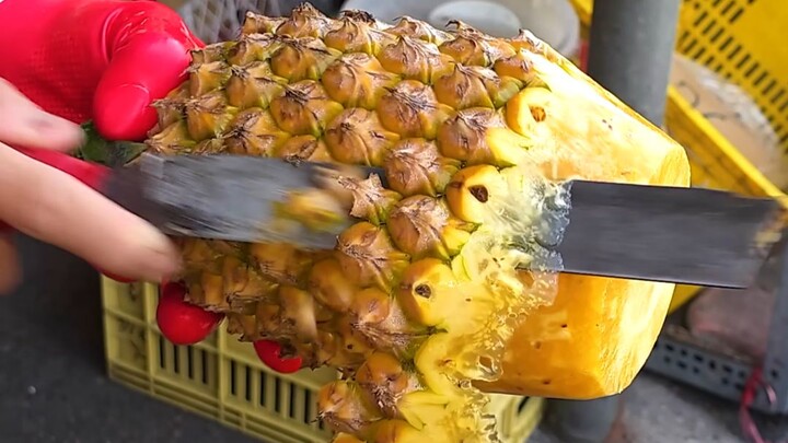 Slicing a pineapple like this