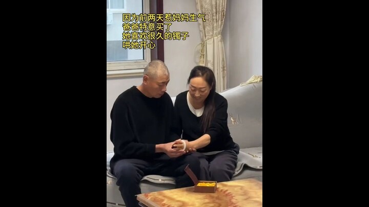 Middle-aged couple shares a kiss…