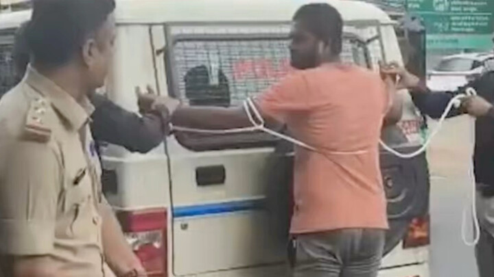 India: Man beaten with a baton by police while being escorted to the scene where he allegedly killed