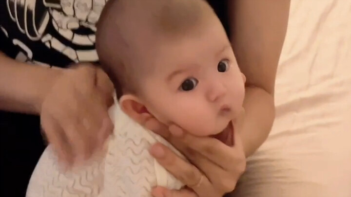 The baby still can’t figure out why they always get beaten after finishing their milk.