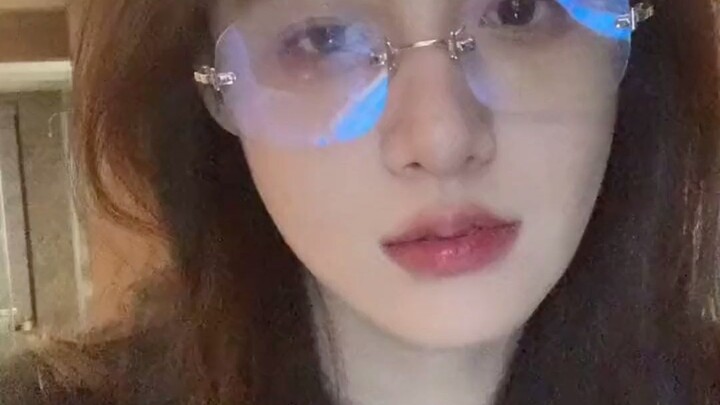 The boy on the screen is smiling.