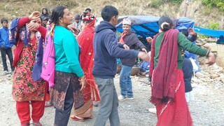 bride and groom dancing with family members in naumati baja |