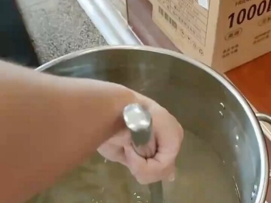 A guy gives an on-the-spot lesson in ladling soup at the cafeteria, while a classmate nearby says, “