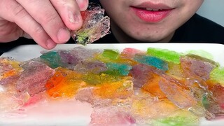 Eating frozen rainbow ice chips to listen to the crunching!