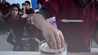 "Challenge: Pick up an orange without spilling the water"