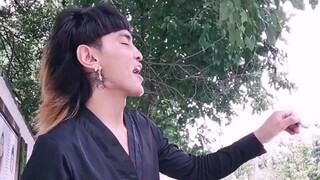 Precious footage of a young Lisu man from Yunnan with short black hair and a mushroom cut.