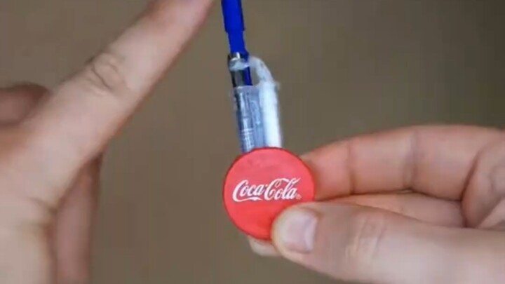 Making a Spider-Man web-shooter out of bottle caps—so impressive!