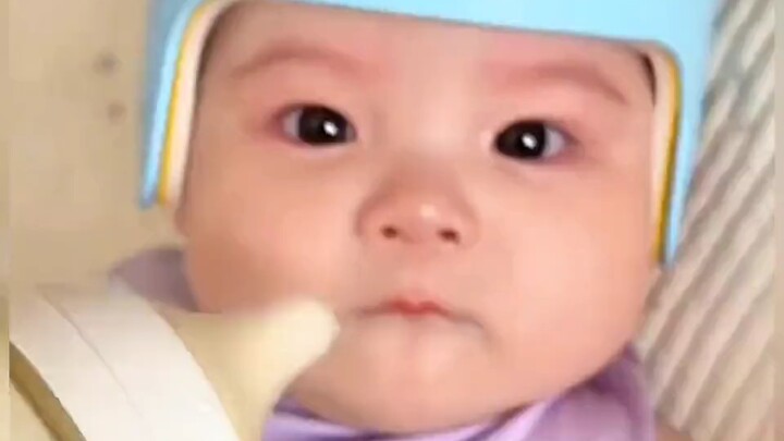 So cute! The baby refuses to drink milk and gets scolded by mom, with teary eyes looking so upset.