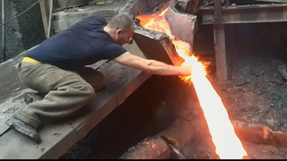 Man Puts Hand In Molten Metal