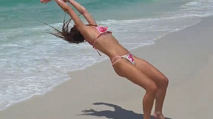 bailey doing backflips on the beach