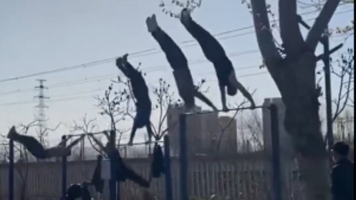 The pull-up bar is covered with elderly men