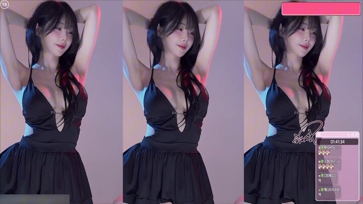 Korean female streamer — BJ Woohankyu in a seductive black slip dress, dancing with charm