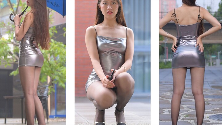 Silver dress, black stockings, high heels