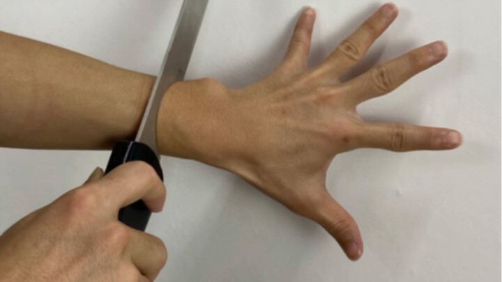 Unveiling the Truth Behind Magic: The Arm-Slicing Trick!