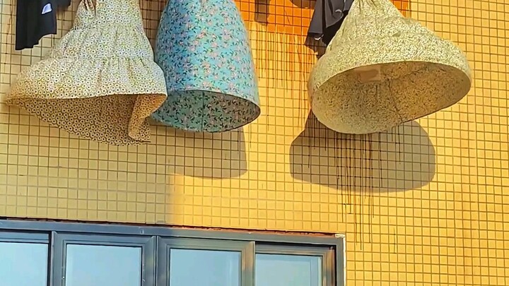 Is the wind fairy secretly trying on a dress? The young lady’s sun-dried sundress is dancing in the 