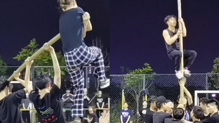 Menjelang Festival 3 Maret kelompok etnis Zhuang, para mahasiswa berlatih tari tiang bambu, memukau 