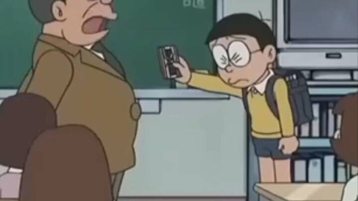 nobita menyerahkan sesuatu