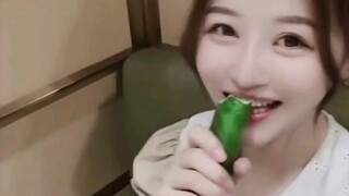 This girl is so cute, I like that cucumber