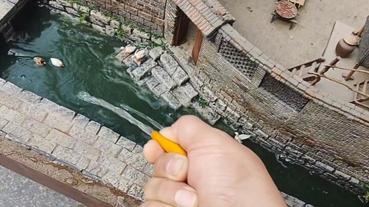 Today, I'm going to take you on a close-up tour of my model artwork, "Spring Water Village."