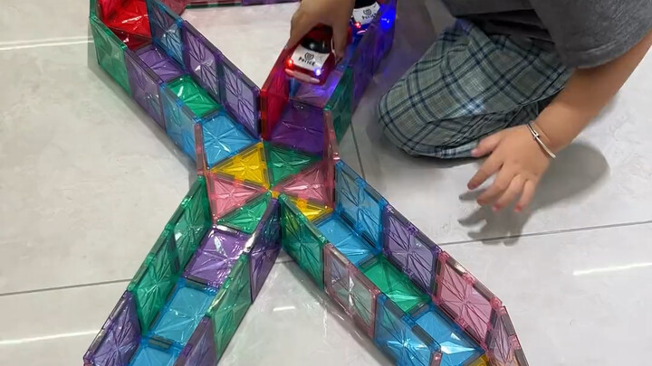 Colorful little cars paired with magnetic tiles are absolutely amazing! This set even comes with bui