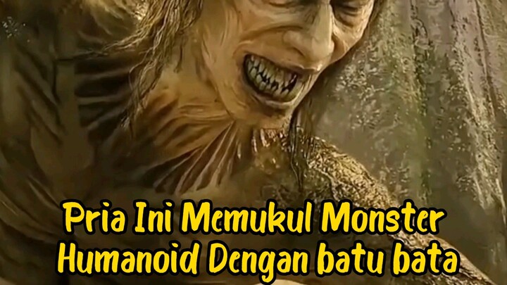 Pria Ini Memukul Monster Humanoid, Dengan batu pata