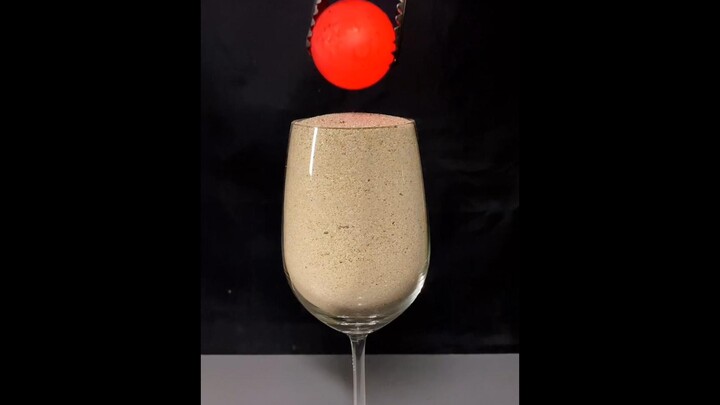 Red-hot iron ball vs sand