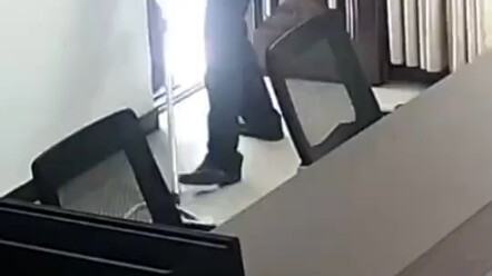 A police officer climbs into a giant python; officers seek help from the fire department.