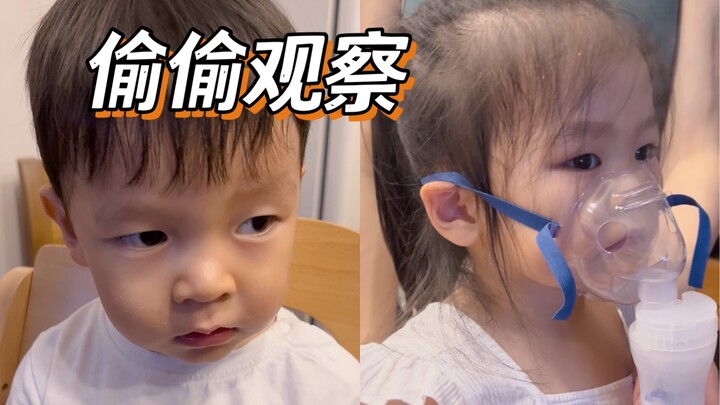 Sister is doing a nebulizer treatment, and her little brother is secretly watching. It’s so tough wh