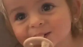 Cute baby saying strawberry