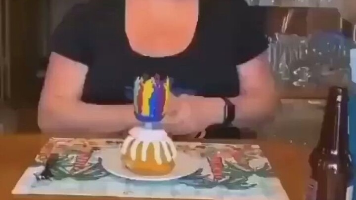 American lady goes wild with delight after seeing a blooming birthday candle for the first time!